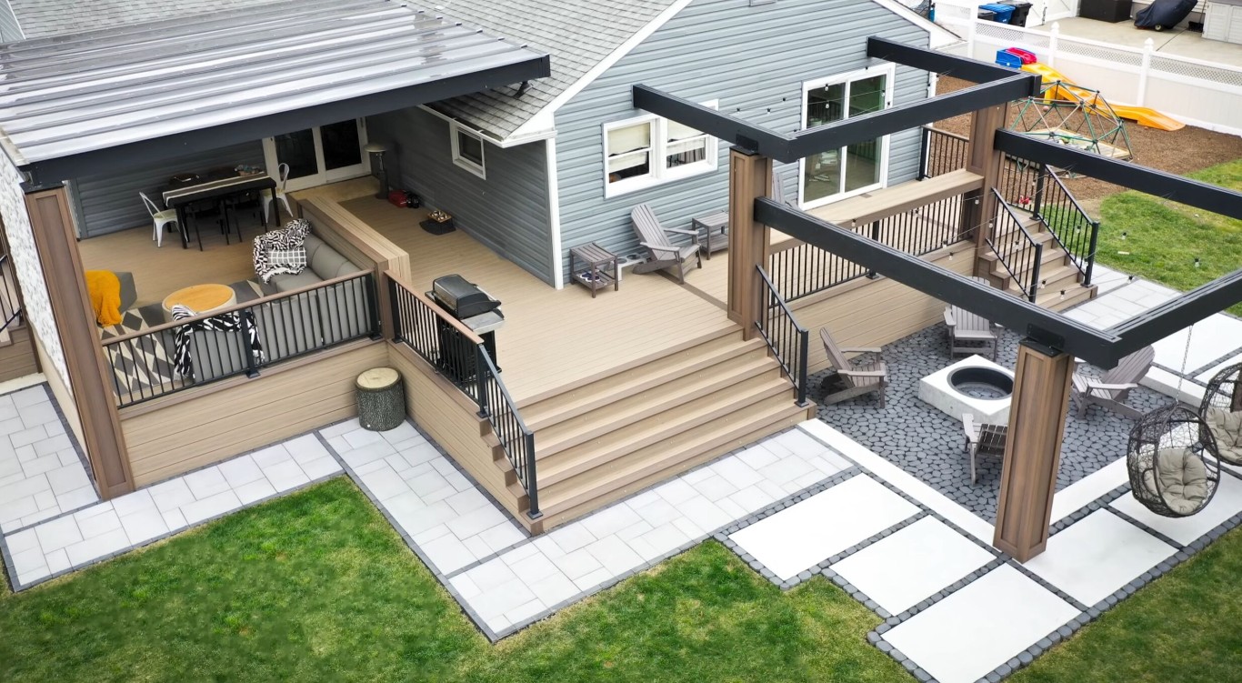 Multi-level deck with distinct dining, lounging, and cooking zones
